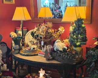 This antique oval Victorian table has wicker accents and is in the formal dining room which is currently "The Christmas Room".