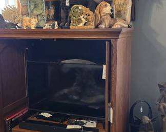 That large framed picture features a white Russian Wolfhound.
