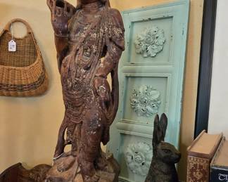 Looks a bit like carved wood, but not wood. Heavy stone. Has a couple of chips and broken spots, but don't we all?