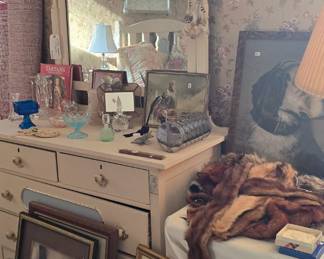 Lots of dog pictures in this bedroom.