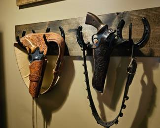 Leather holsters, replica guns
