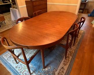 Teak dining table with 2 leaves. Attributed to Harry Ostergaard