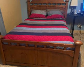 FULL SIZED WOOD BED -NO MATTRESS  JUST THE BED 