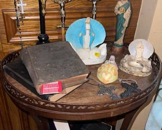 Various religious items.  Vintage and antique Bibles.  Now on the small seashell item to the far right...now that needs statue needs to be glued back down, but it was too cute to part with and it's part of Galveston history too....