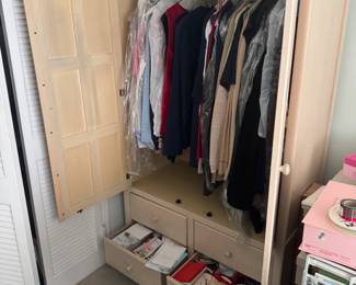 Closet of assorted women’s vintage clothing.