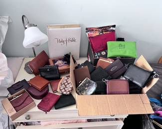 assorted wallets of all kinds including Nine West, Coach, plus more! leathers, brand new boxed 