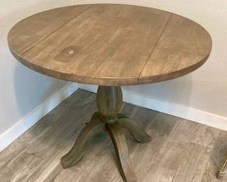Wood 36" Round Drop Leaf Pedestal Table.