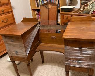 Antique vanity (Mirror is wrapped in background against shelves)