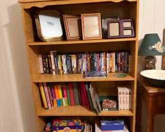 Bookshelf, DVDs, books, games, frames (All sold separately)