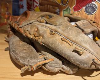 Vintage baseball gloves (well-worn)