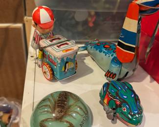 Vintage Tin Wind-Up Toys, Souvenir Scorpion Dome, and Retro Desk Oddities

