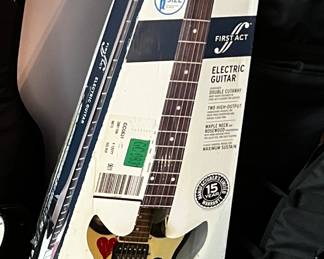 Electric guitar First Act double cutaway, too high-output, Mabel neck fingerboard