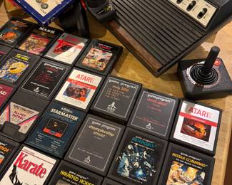 Atari 2600 console, Loose Atari games, including Pac-Man, Combat, Asteroids, Missile Command,



