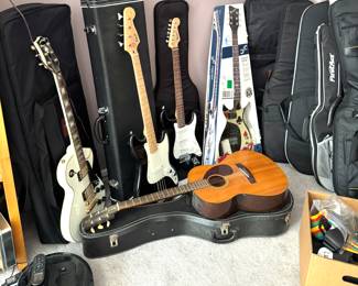 Arbor Post-Lawsuit Era Single Cut-Style Electric Guitar (1980s, Antique White) Electric guitar Squier Bronco Base by Fender
Electric guitar Squier Strat by Fender
Electric guitar First Act double cutaway, too high-output, Mabel neck fingerboard
Acoustical guitar Yamaha FG-75