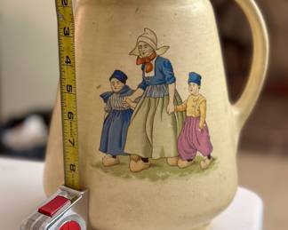 Eleven and a half inch tall early Roseville Pottery Dutch creamware pitcher. Imperfect due to a number of small chips on lip. Introduced 1910. Unmarked as the company did not start marking until 1924.