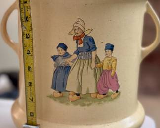 Eleven and a half inch tall early Roseville Pottery Dutch creamware two-handle lidded pot. Imperfect due to a number of small chips on lip. Introduced 1910. Unmarked as the company did not start marking until 1924.