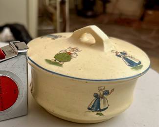 Two and one-half inch tall early Roseville Pottery Dutch creamware lidded bowl. A few chips on edge of bowl. Introduced 1910. Unmarked as the company did not start marking until 1924.