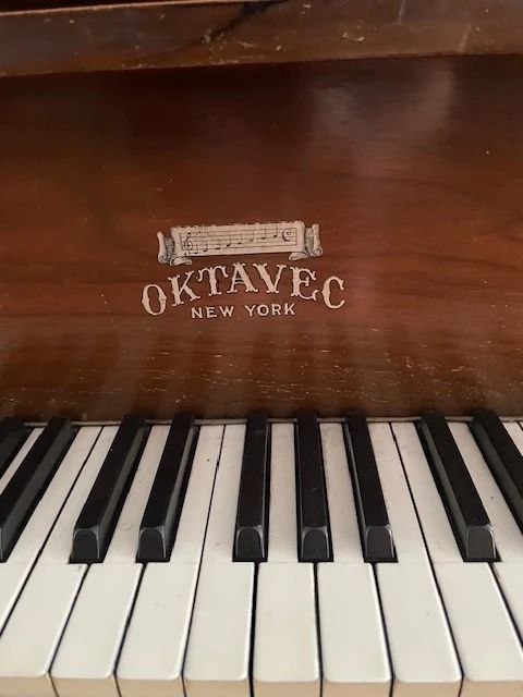 Oktavec piano in fine working condition. All keys play and the tone is beautiful. Built in 1921.