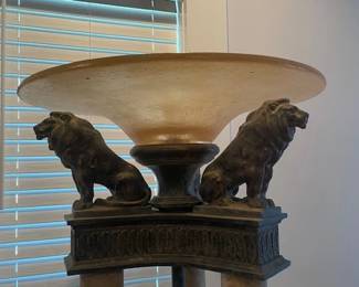 Lions guarding their domain atop torchiere lamp.