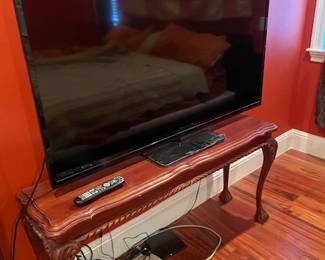 60" big screen TV, rarely used, with clear, sharp screen. Free Firestick with purchase of TV. Sofa table in the Chippendale style, measures 28"H x 55" L x 15" D