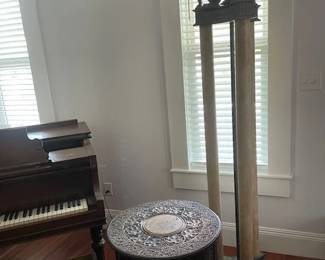 Elegant torchiere lamp, 76" H with dimmer switch. Three columns topped by three lions with opaque glass shade that provides soft uplighting. Also depicted is a fine antique wooden folding octagonal table with intricate patterns throughout. From Calcutta, India.