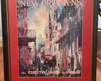 Framed vintage Delta air poster with destination New Orleans, adding a bit of nostalgia. Measures 36" H x 30" W