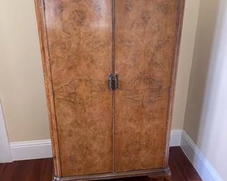 Antique burl walnut wardrobe, with interior hangers and shelves. Very sturdy. See next picture. Measures 60H x 33 L x 18 W