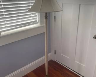 Floor lamp with heavy gilt base and radiating leaf pattern on top. Measures 63" H. See next photo.