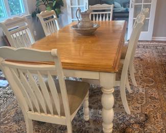 Farmhouse table with six chairs. Top of table needs a little bit of TLC.