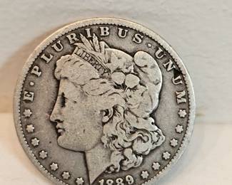 1889 O Morgan Silver Dollar https://www.auctionninja.com/stress-free-estate-services-llc/sales/details/collectors-cache-auction-coins-vintage-toys-jewelry-collectibles-ephemera-silver-and-more-no-reserves-shipping-available-or-alton-nh-pickup-36.html?an=pptvtd