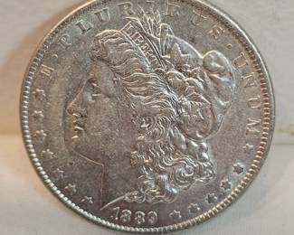 1889 Morgan Silver Dollar https://www.auctionninja.com/stress-free-estate-services-llc/sales/details/collectors-cache-auction-coins-vintage-toys-jewelry-collectibles-ephemera-silver-and-more-no-reserves-shipping-available-or-alton-nh-pickup-36.html?an=pptvtd