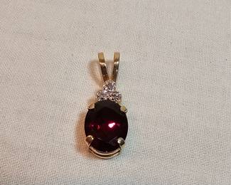 14k Gold With Garnet And Diamonds Pendant  https://www.auctionninja.com/stress-free-estate-services-llc/sales/details/collectors-cache-auction-coins-vintage-toys-jewelry-collectibles-ephemera-silver-and-more-no-reserves-shipping-available-or-alton-nh-pickup-36.html?an=pptvtd