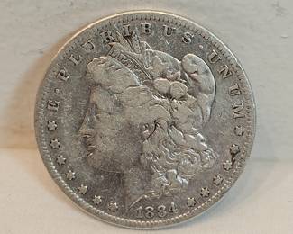 1884 S Morgan Silver Dollar  https://www.auctionninja.com/stress-free-estate-services-llc/sales/details/collectors-cache-auction-coins-vintage-toys-jewelry-collectibles-ephemera-silver-and-more-no-reserves-shipping-available-or-alton-nh-pickup-36.html?an=pptvtd