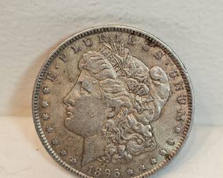 1896 Morgan Silver Dollar  https://www.auctionninja.com/stress-free-estate-services-llc/sales/details/collectors-cache-auction-coins-vintage-toys-jewelry-collectibles-ephemera-silver-and-more-no-reserves-shipping-available-or-alton-nh-pickup-36.html?an=pptvtd