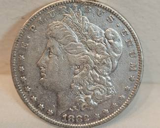 1882 Morgan Silver Dollar  https://www.auctionninja.com/stress-free-estate-services-llc/sales/details/collectors-cache-auction-coins-vintage-toys-jewelry-collectibles-ephemera-silver-and-more-no-reserves-shipping-available-or-alton-nh-pickup-36.html?an=pptvtd