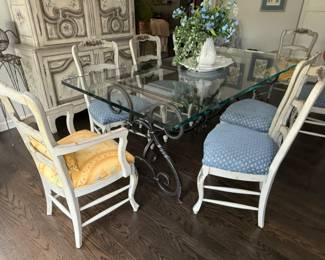 Kitchen dinging set with hand forged metal base and glass top with 8 country French style chairs with Scalamandre upholstery