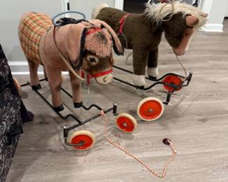 Two vintage Steiff rolling animal toys