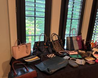 Tons of handbags and purses 