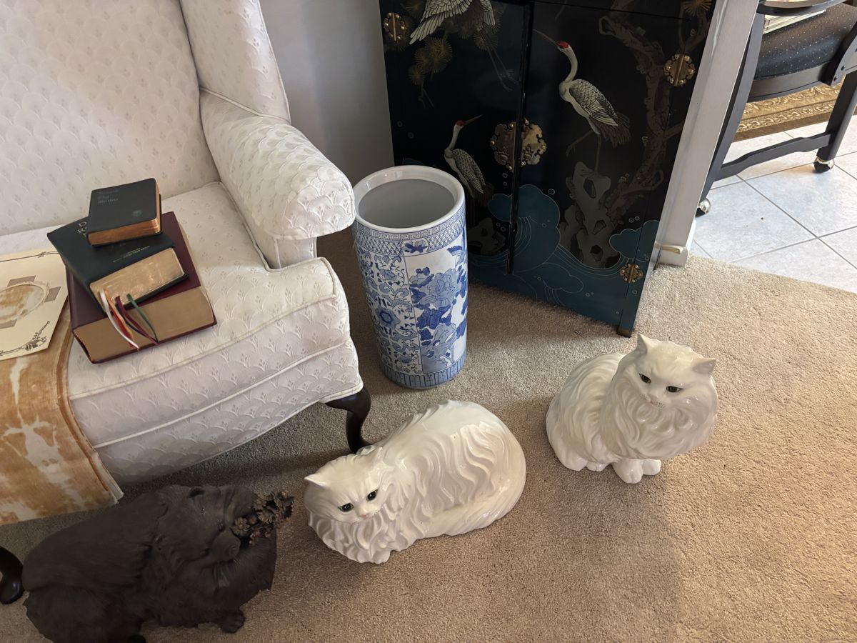 2 matching wing back chairs, umbrella holder, 2 large ceramic cats