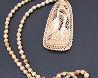 vintage carved bone pendant