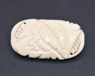 vintage carved bone brooch