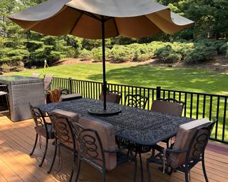 Cast aluminum table, 8 chairs and umbrella
