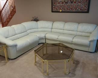 Cream  color sectional  sofa.  There  are  three pieces.  two pieces that include the center piece measure 94".  one 3 cushion end piece measures 74"