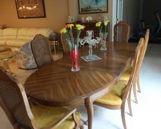 Bernhardt dining  room  table  and 6  chairs. Table  is  60"  x  40"  There  are  2   leaves that are  18"  each.