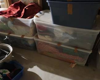   many boxes  and  bins of  fabric 