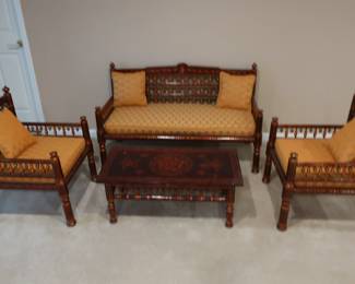 Set  of  furniture with  an  India  appearance.  There  are  two  chairs,  one  loveseat,  one coffee  table.