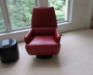 Red  faux  leather  swivel  chair.  There  are  two.   Small  black  storage  piece is  also  in  photo.   It  is 29"  wide  x  29"  deep.   The  base  is  chrome  color.