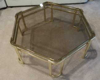 6  sided  glass  top  and  brass  table  It  is  42"  across.