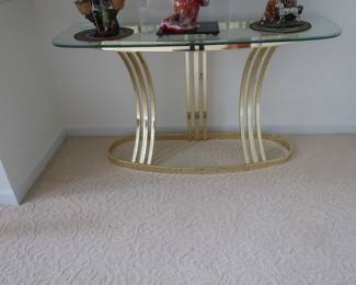 Glass  top  library  table  with  brass  frame.  It  is  4"  x  18".