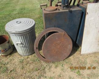1958 trash can, man hole cover